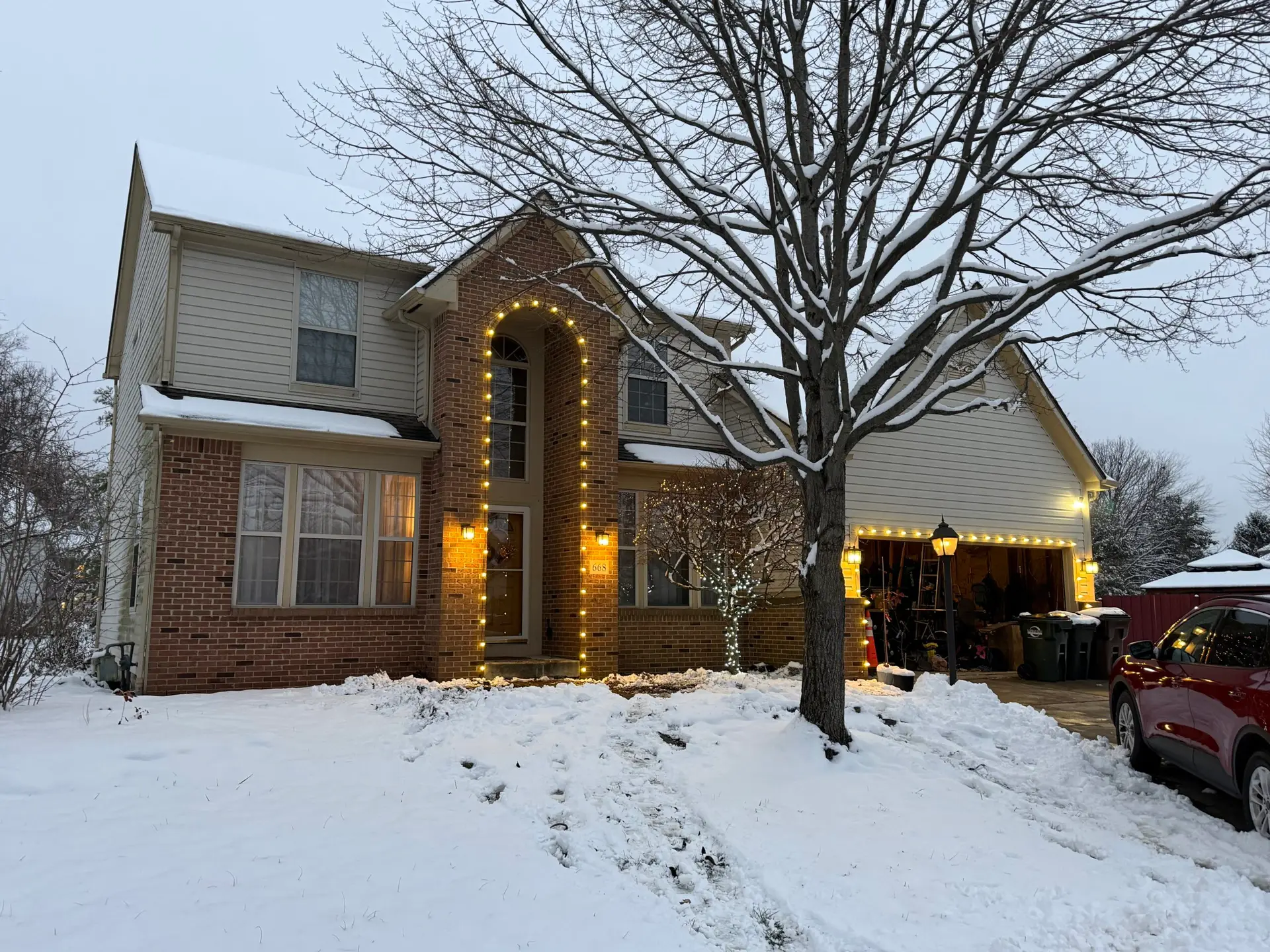 Holiday lights installed on a home exterior